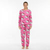 Woman wearing rose pink Hello Kitty Pajama Set with oversized white Kitty face and bow print