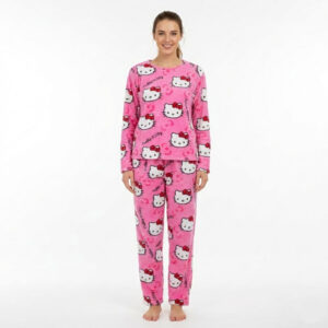 Woman wearing rose pink Hello Kitty Pajama Set with oversized white Kitty face and bow print